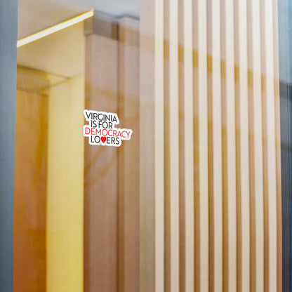 Decorative sticker on a glass surface with text 'Virginia is for democracy lovers'.