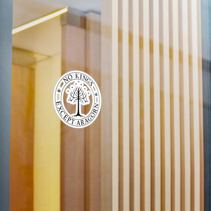Circular sticker with the text "No kings except Aragorn" and a graphic of a white tree with seven stars above it and the crown of the king of Gondor. The sticker is shown on glass.